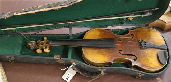 A full sized cased violin with bow